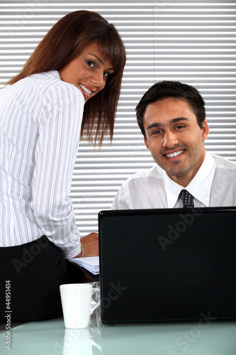 Photo: Coworkers at work. Coworkers at work.