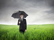 Foto: Businessman with an Umbrella Businessman with an Umbrella