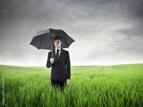 Photo: Businessman with an Umbrella Businessman with an Umbrella