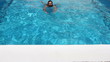 man swim in swimming pool