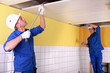 duo of electricians working indoors
