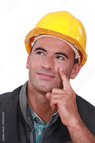 Photo: Builder thinking of an idea Builder thinking of an idea