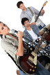 Angled studio shot of a young rock band