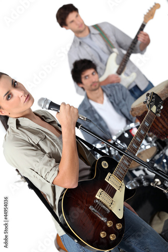 Photo: Angled studio shot of a young rock band Angled studio shot of a young rock band