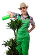 Girl watering plants on white