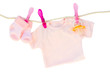 baby girl clothes hanging on rope