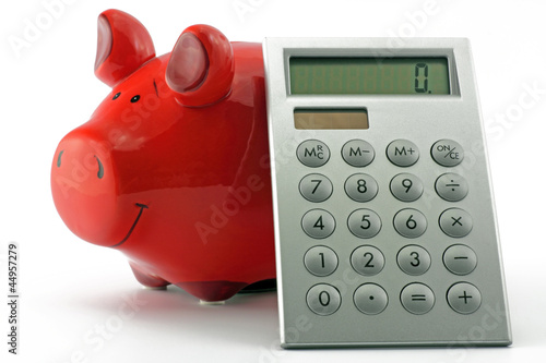 Photo: sparschwein mit tschenrechner sparschwein mit tschenrechner
