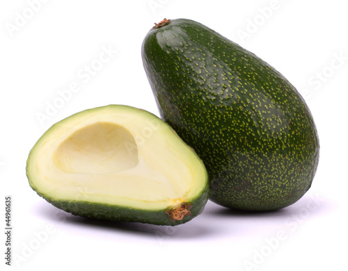 Photo: Ripe cut avocado isolated on white background Ripe cut avocado isolated on white background