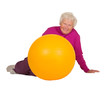 Healthy retired woman with gym ball