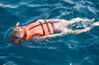little girl swimming in diving mask