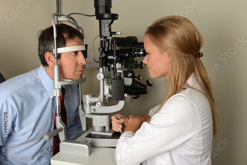 Photo: Eye Doctor With Patient During Exam Eye Doctor With Patient During Exam
