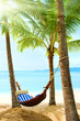Beautiful tropical beach with palm tree and sand