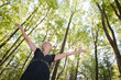 Foto: Young woman in green forest Young woman in green forest
