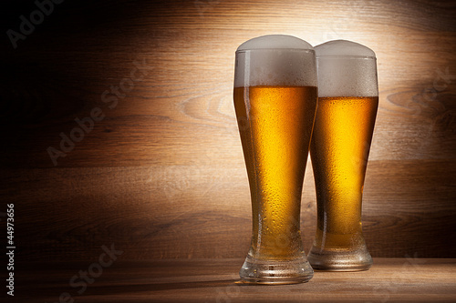 Photo: Beer into glass on a old stone Beer into glass on a old stone