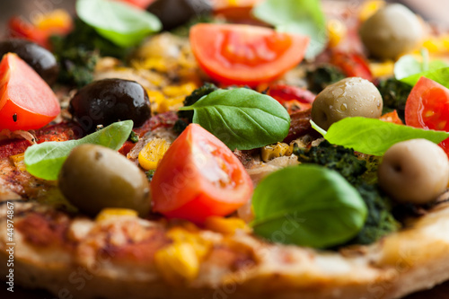 Photo: Close up of pizza with marinated olives Close up of pizza with marinated olives