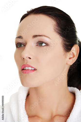 Photo: Portrait of young beautiful woman in bathrobe Portrait of young beautiful woman in bathrobe