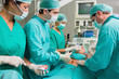 Concentrated surgeons operating a patient
