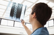 Nurse is checking an x-ray