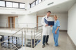 Nurse and doctor looking in folder