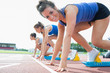 Photo: Happy woman at starting blocks Happy woman at starting blocks