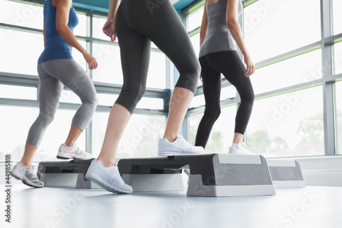 Photo: Three women doing aerobics Three women doing aerobics