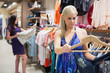 Photo: Women looking at clothes on rail Women looking at clothes on rail