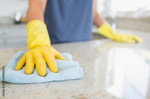Photo: Woman cleaning the counter Woman cleaning the counter