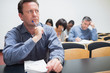 Photo: Man thinking while writing Man thinking while writing