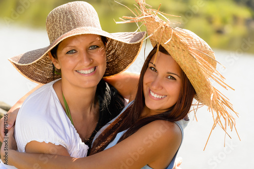 Photo: Mother and daughter hugging outdoors summer teen Mother and daughter hugging outdoors summer teen