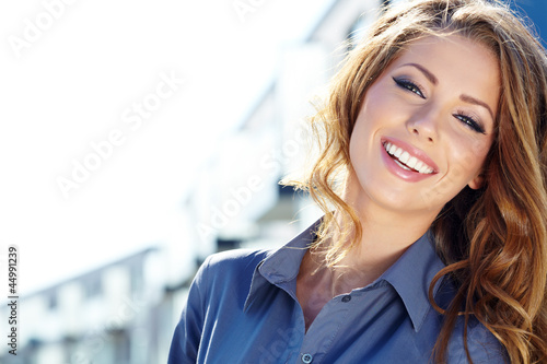Photo: Young happy women or student on the property business background Young happy women or student on the property business background