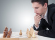 Photo: business man playing chess, making the move business man playing chess, making the move