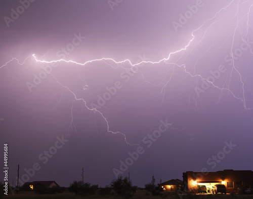 Photo: A Lightning Bolt Streaks Above a Neighborhood A Lightning Bolt Streaks Above a Neighborhood