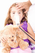 Little girl inhaling medicine