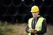 Photo: construction worker using digital tablet construction worker using digital tablet