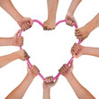 Hands holding pink heart isolated on white