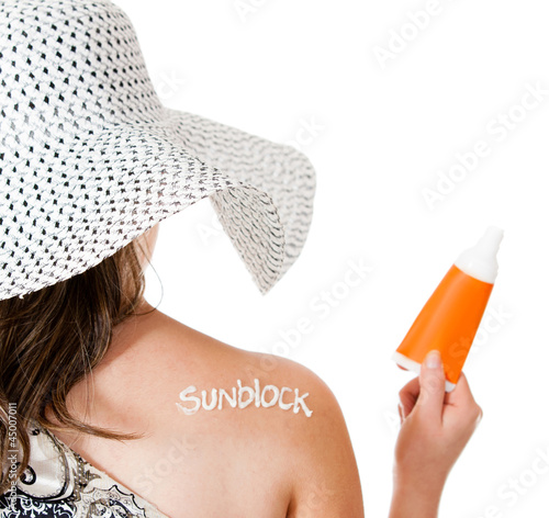 Photo: Summer woman wearing sunblock Summer woman wearing sunblock