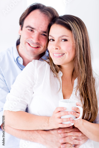 Photo: Happy couple at home Happy couple at home