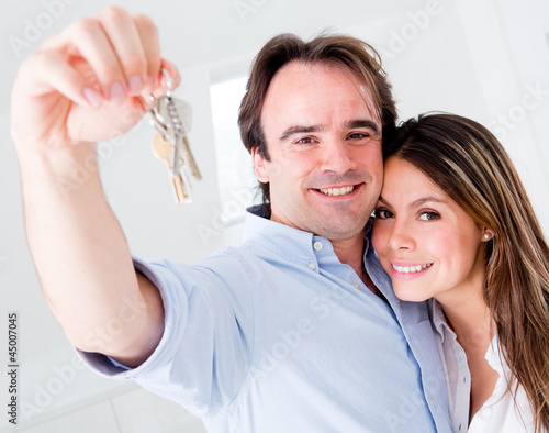Photo: Couple holding keys Couple holding keys