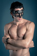 Portrait of young man shirtless with mask 