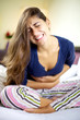 Beautiful young woman with very strong stomach ache