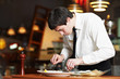 working waiter in uniform at restaurant