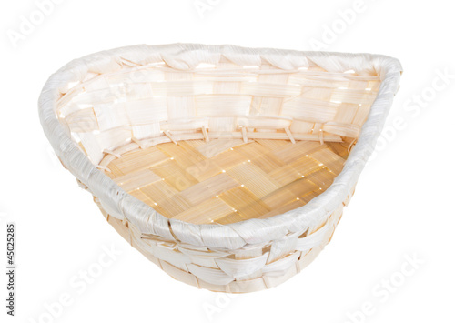 Photo: Wickerwork empty yellow breadbasket on white background Wickerwork empty yellow breadbasket on white background