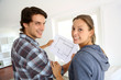 New property owners looking at home blueprint