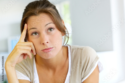 Photo: Closeup of woman with thoughtful look Closeup of woman with thoughtful look