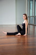 Happy Woman Practicing Yoga In Gym