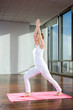 Woman Practicing Yoga On Mat
