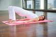 Woman Practicing Yoga On Mat