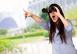 Photo: Portrait Of A Young Woman Looking Through Binoculars Portrait Of A Young Woman Looking Through Binoculars