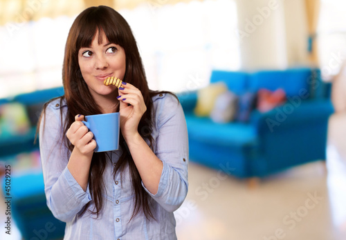 Photo: Beautiful Woman With Coffee And Cookies Beautiful Woman With Coffee And Cookies