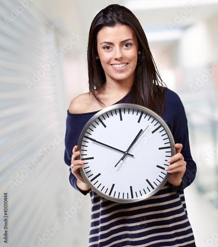 Photo: Young Girl Showing Clock Young Girl Showing Clock